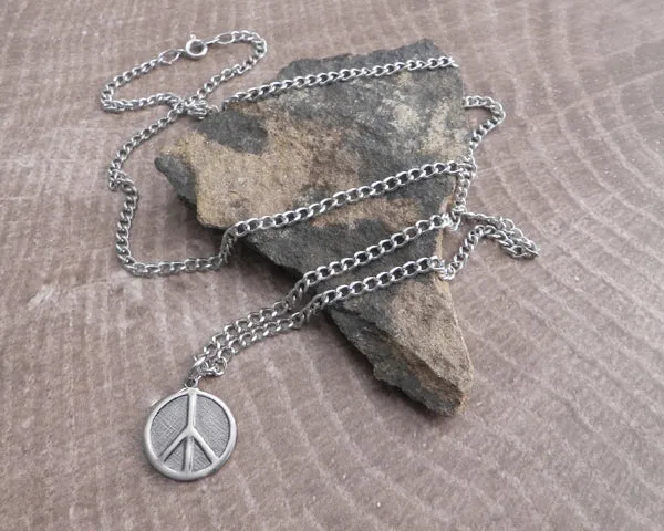 Peace Sign on thin curb Stainless Steel